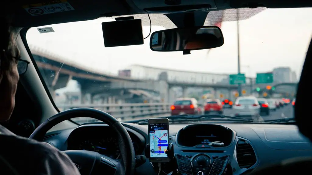 Uber Driver with Road Map in Phone