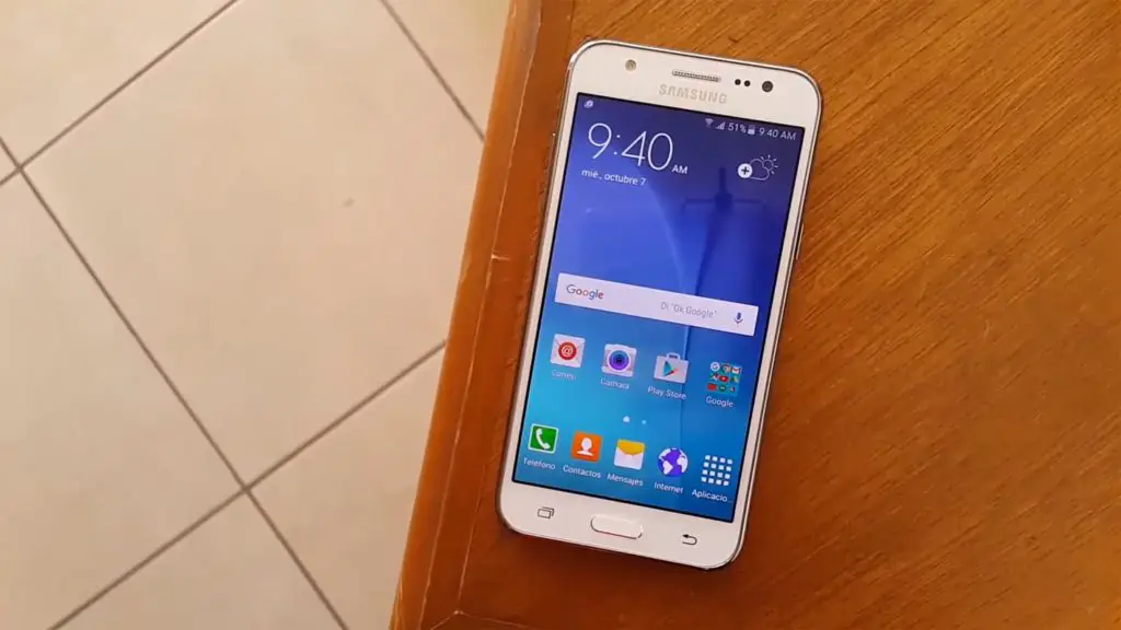 Samsung Galaxy J5 on the Wooden Table