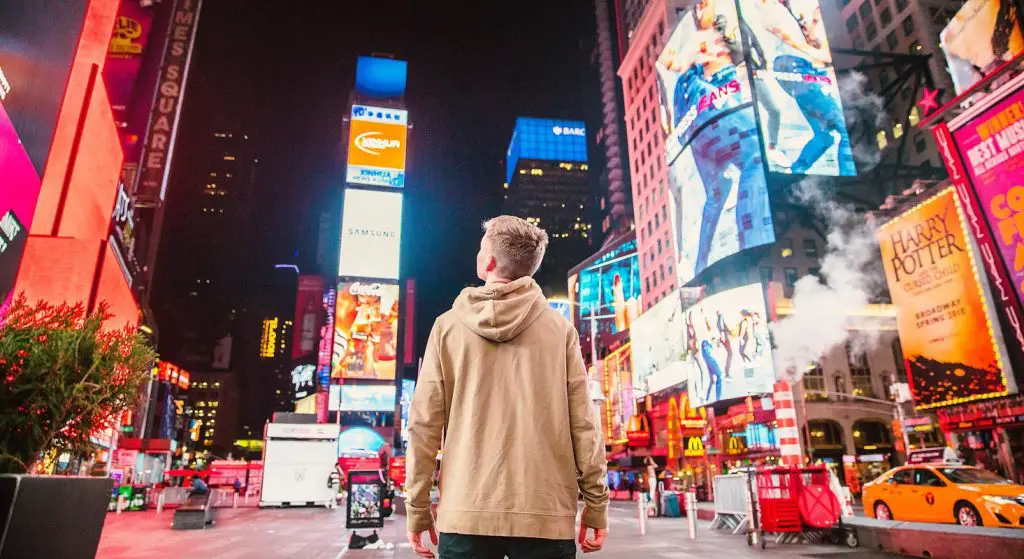 Person Looking Digital Banner Ads in Street