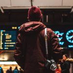 Person Watching Flight Schedule in Airport