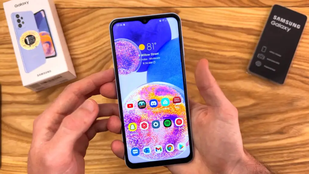 samsung galaxy a23 home screen in double hand